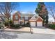 Charming two-story red brick home featuring manicured landscaping, a two-car garage, and a welcoming front entrance at 3405 Belridge Se Dr, Smyrna, GA 30080