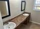Bathroom with double vanity and large mirrors above both sinks at 4227 Sheppard Xing Way, Stone Mountain, GA 30083