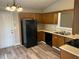 Kitchen with a black refrigerator and dishwasher and a stainless steel sink at 4227 Sheppard Xing Way, Stone Mountain, GA 30083