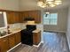 Kitchen with a black gas range and stainless steel sink and faucet at 4227 Sheppard Xing Way, Stone Mountain, GA 30083