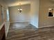 Open-concept living room with ceiling fan and wood flooring at 4227 Sheppard Xing Way, Stone Mountain, GA 30083