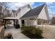 Backyard features a cozy gazebo, carport, and greenery, creating a private outdoor oasis at 5130 Forest Hills Ct, Cumming, GA 30041