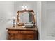 Bathroom features a vintage-style vanity with a vessel sink and ornate mirror at 5130 Forest Hills Ct, Cumming, GA 30041