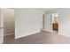 Neutral bedroom with gray walls, walk-in closet, and access to an ensuite bathroom at 5130 Forest Hills Ct, Cumming, GA 30041