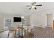 Bonus room features vaulted ceilings, brick floors, and a seating area at 5130 Forest Hills Ct, Cumming, GA 30041