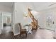 Entryway features brick floors, staircase, and seating area at 5130 Forest Hills Ct, Cumming, GA 30041