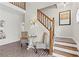 Entryway features stairs, seating area, and brick floors at 5130 Forest Hills Ct, Cumming, GA 30041