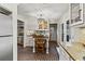 Eat in kitchen features a dining table, custom cabinets, and stainless appliances at 5130 Forest Hills Ct, Cumming, GA 30041