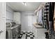 Laundry room with front-loading washer and dryer and ample counter space at 5130 Forest Hills Ct, Cumming, GA 30041