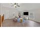 Bright living room features vaulted ceilings, ceiling fan, and brick floors at 5130 Forest Hills Ct, Cumming, GA 30041