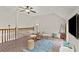 Upstairs living area with vaulted ceilings, brick floors, and plenty of natural light at 5130 Forest Hills Ct, Cumming, GA 30041