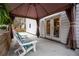 Relaxing covered patio with comfortable seating and access to the home's interior at 5130 Forest Hills Ct, Cumming, GA 30041