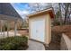 A backyard storage shed with double doors, ideal for storing tools and outdoor equipment at 5130 Forest Hills Ct, Cumming, GA 30041