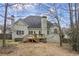 View of the home's backyard featuring a wooden deck and an exterior hot tub at 1213 Fairwinds Dr, Loganville, GA 30052