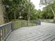 Backyard view shows a wooden deck overlooking trees and green space at 1298 Belmont Se Ave, Smyrna, GA 30080