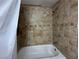 Tiled bathtub and shower with shower head at 1298 Belmont Se Ave, Smyrna, GA 30080