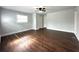 Spacious bedroom featuring laminate floors, light-colored walls, and a ceiling fan for comfort at 1298 Belmont Se Ave, Smyrna, GA 30080