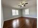 Bedroom with hardwood floors, a ceiling fan, and natural light at 1298 Belmont Se Ave, Smyrna, GA 30080