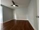 Bedroom features wood floors, neutral paint, and a ceiling fan at 1298 Belmont Se Ave, Smyrna, GA 30080