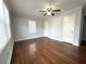 Bedroom with hardwood floors, a ceiling fan, and natural light from the window at 1298 Belmont Se Ave, Smyrna, GA 30080