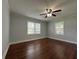 Bedroom featuring hardwood floors, neutral walls, ceiling fan, and natural light at 1298 Belmont Se Ave, Smyrna, GA 30080