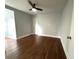 Spacious bedroom featuring hardwood floors, a ceiling fan, and neutral wall colors at 1298 Belmont Se Ave, Smyrna, GA 30080