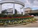 The entrance to Smyrna Market Village features a flower bed of colorful tulips and an archway with the town name at 1298 Belmont Se Ave, Smyrna, GA 30080