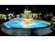 Night view of a tiered fountain illuminated with lights enhancing its beauty at 1298 Belmont Se Ave, Smyrna, GA 30080