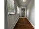Hallway features wood floors and two windows at 1298 Belmont Se Ave, Smyrna, GA 30080