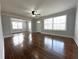 Bright living room features hardwood floors, large windows, and neutral paint at 1298 Belmont Se Ave, Smyrna, GA 30080