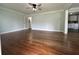 Spacious living room featuring hardwood floors, crown molding, and neutral paint at 1298 Belmont Se Ave, Smyrna, GA 30080