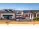 The Greek Village Taverna next to a Belmont sign and fountain at 1298 Belmont Se Ave, Smyrna, GA 30080