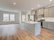 Spacious kitchen with an island, stainless steel appliances, and plenty of natural light at 3151 Washburn Sw St, Atlanta, GA 30354