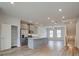 Bright kitchen with gray cabinets, an island, stainless steel appliances, and pantry at 3151 Washburn Sw St, Atlanta, GA 30354