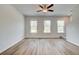 Open living room with three large windows providing ample natural light at 3151 Washburn Sw St, Atlanta, GA 30354