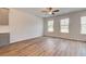 Bright living room featuring wood floors, a ceiling fan, and natural light at 3151 Washburn Sw St, Atlanta, GA 30354