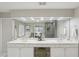Bright bathroom featuring double sinks, a vanity, and a large, well-lit mirror at 1307 Calderwood Se Ct, Smyrna, GA 30080
