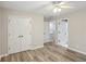Bright bedroom featuring modern flooring, neutral paint, and ample closet space at 1307 Calderwood Se Ct, Smyrna, GA 30080