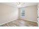 Cozy bedroom showcasing modern flooring, natural lighting, and neutral paint at 1307 Calderwood Se Ct, Smyrna, GA 30080