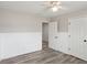 Bedroom with modern flooring, neutral paint, wainscoting, and ample closet space at 1307 Calderwood Se Ct, Smyrna, GA 30080