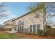 Exterior back view of the home featuring an outdoor patio, pergola, and a spacious yard at 1307 Calderwood Se Ct, Smyrna, GA 30080