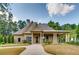Charming one-story home with well-maintained landscaping, covered entrance, and neutral-colored exterior at 1307 Calderwood Se Ct, Smyrna, GA 30080