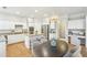 Modern kitchen with white cabinets, stainless steel appliances, and a center island at 1307 Calderwood Se Ct, Smyrna, GA 30080
