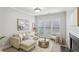 Cozy living room with a plush sofa, stylish decor, and a large window for natural light at 1307 Calderwood Se Ct, Smyrna, GA 30080