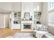 Cozy living room featuring a fireplace and elegant built-in shelving at 1307 Calderwood Se Ct, Smyrna, GA 30080