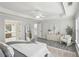 Bright main bedroom with a tray ceiling, wood floors, and an en-suite bathroom at 1307 Calderwood Se Ct, Smyrna, GA 30080