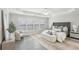 Serene main bedroom features a tray ceiling, neutral tones, and a cozy seating area at 1307 Calderwood Se Ct, Smyrna, GA 30080