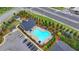 Aerial view of a community pool and clubhouse, surrounded by trees and parking at 2137 Post Grove Rd, Snellville, GA 30078