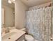 Bathroom featuring a single sink vanity, toilet, and shower with curtain at 2137 Post Grove Rd, Snellville, GA 30078