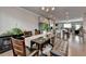 Spacious dining area featuring a modern table, dark floors, and stylish decor at 2137 Post Grove Rd, Snellville, GA 30078